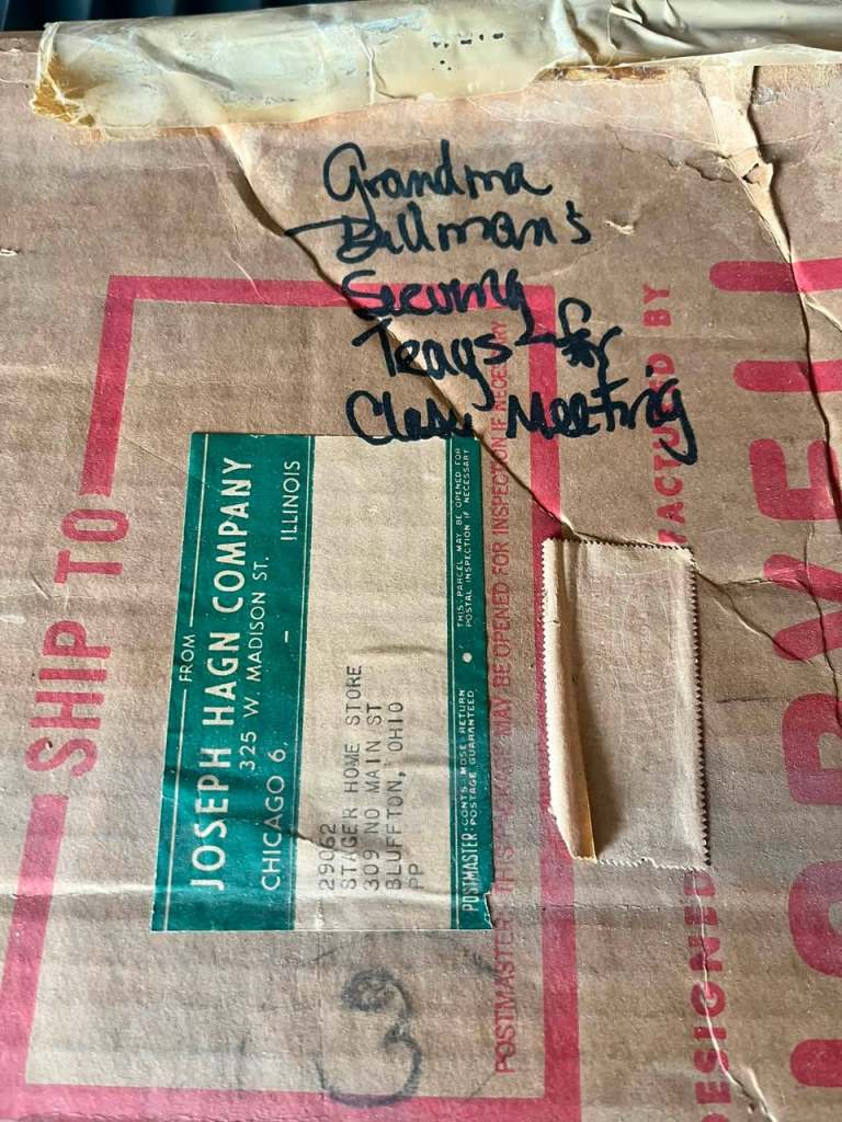 Box with shipping label and handwriting